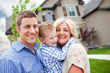 Young family outside their recently Santa Clara, CA house.