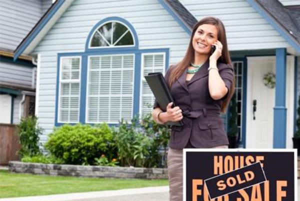 San Bernardino based real estate investor standing outside home after purchasing it in cash.